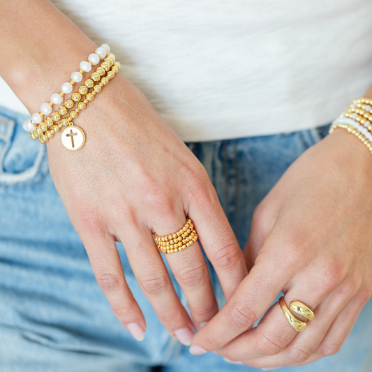 Beaded Stretch Bracelet With Cut-Out Cross Charm